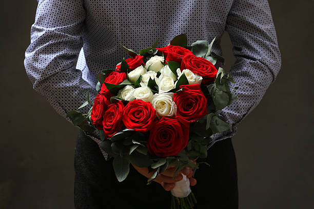 istock man with a bouquet of roses 537370551
