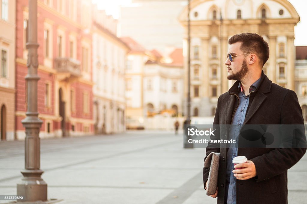 Businessman In The City With Coffee 20-29 Years Stock Photo