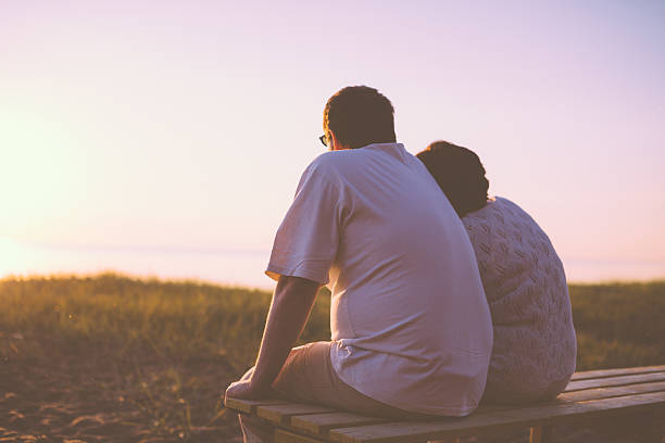 istock Senior couple enjoy the sunset together 537371397