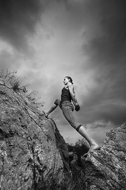 istock Woman doing yoga against the setting sun 537372561