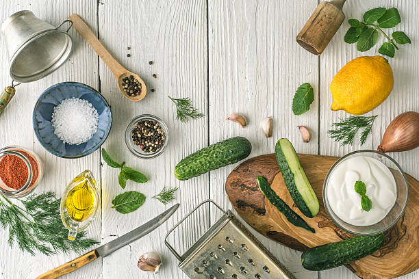 istock Ingredients for tzatziki preparation on white  wooden table  top view 537372716