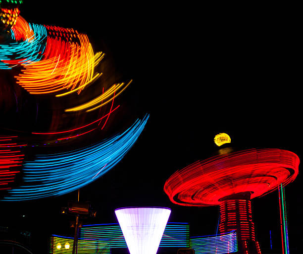 istock Light Trails of spinning carnival ride lights. 537373006