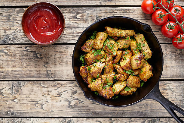 istock Fried sliced chicken or turkey fillet meat with ketchup 537373338
