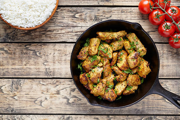 Fried sliced chicken or turkey fillet meat with rice