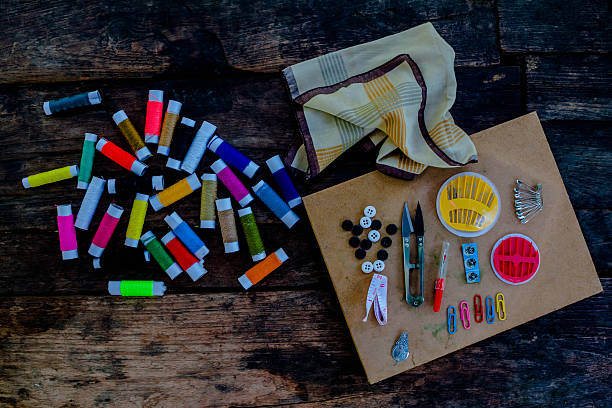 istock Thread and sewing Old  tools on the old wooden background. 537373692