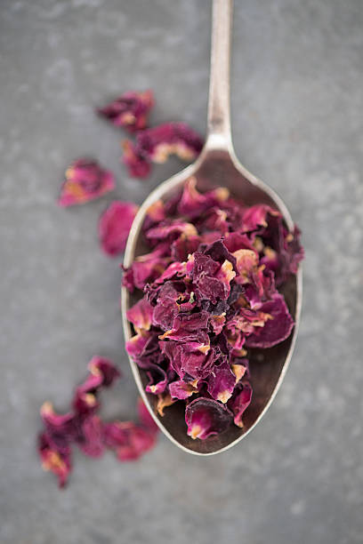 istock Overhead View of Dried Rose Petals on Spoon 537373718