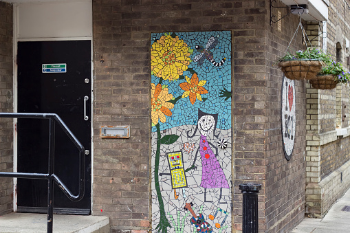 London, England - May 19, 2016: A street mosaic created by the students of Prior Western Primary School, working with artists Carrie Reichardt, Karen Wydler and Sian Smith. Supported by Islington Council, Whitecross Street Party, Whitecross Street Community Centre and Peabody in London, England.