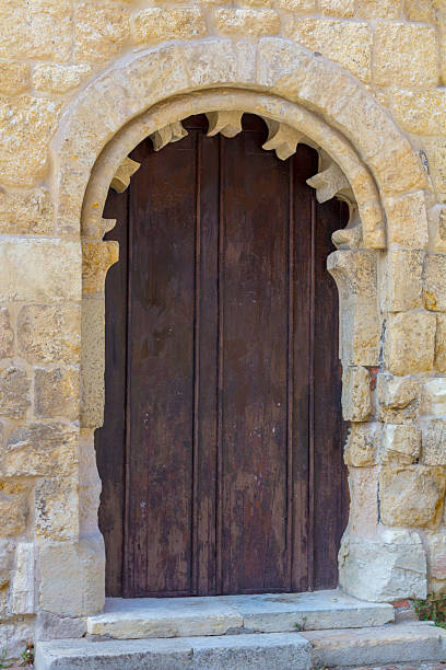 istock Old wooden door on a facade 537374994