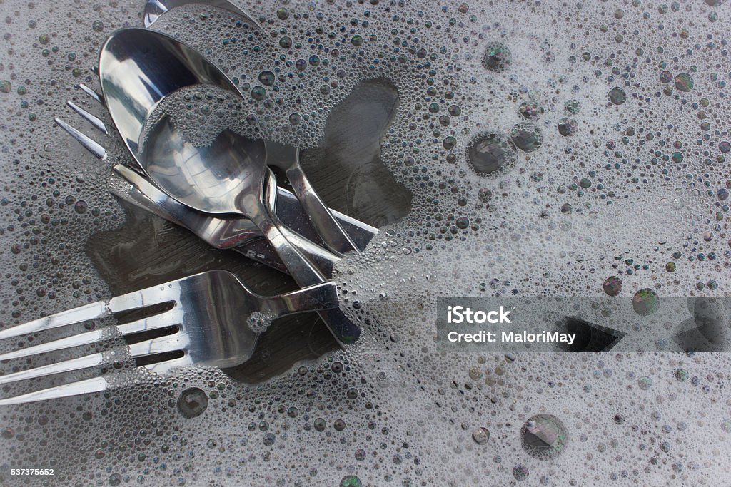 Silverware in Bubble Soap Cutlery in Bubble soap Bar Of Soap Stock Photo