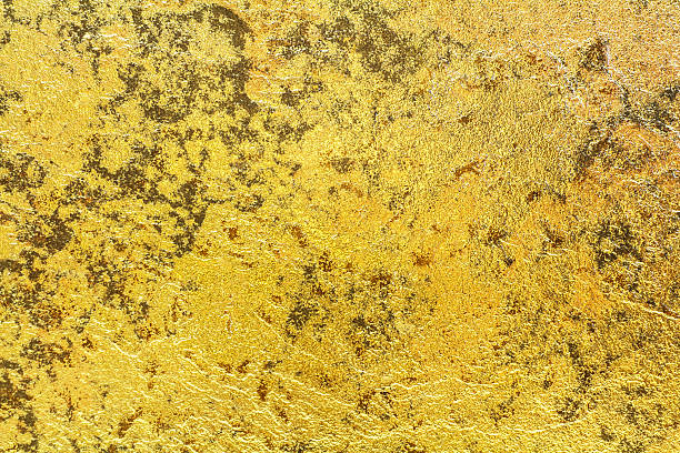 istock Abstract background texture of stone wall in yellow gold tone. 537377776