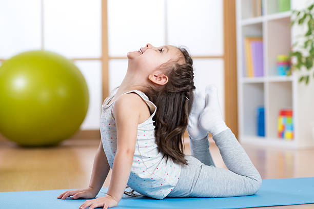 istock Child girl doing gymnastics 537378078
