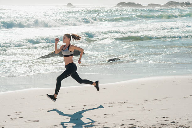 istock woman running on the beach 537378168