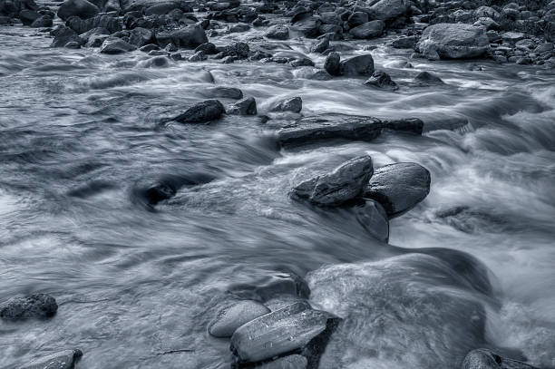 istock River water flowing through rocks at dawn 537379198