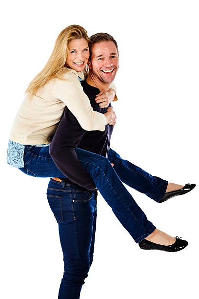 istock Cheerful mature couple enjoying themselves over white 537379638