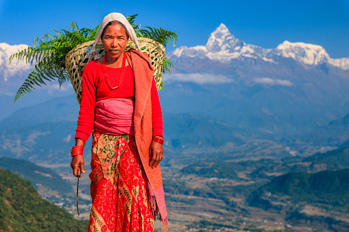 Nepali woman carrying basket near Pokhara.http://bhphoto.pl/IS/nepal_380.jpg