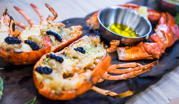 istock Boiled Lobsters serving with Caviar on black tray 537379998