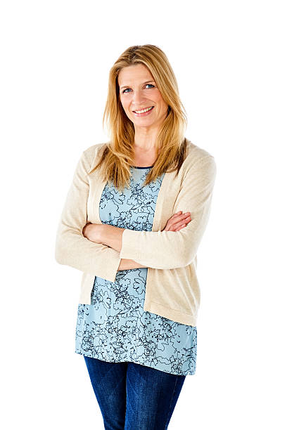 istock Charming mature woman standing with her arms crossed 537380110