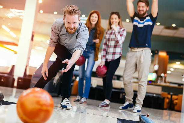 istock Friends enjoying bowling at club 537381282