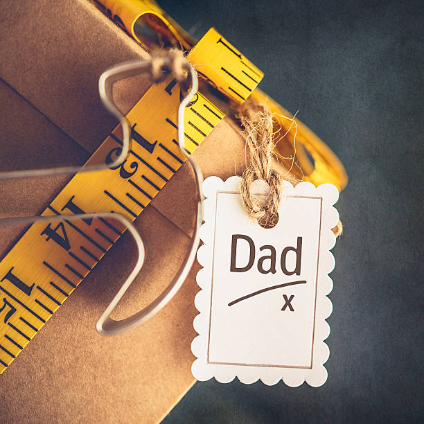 istock Father's Day gift for DIY dad with tape measure bow 537383132