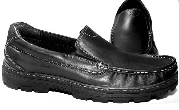 istock Men black cows leather shoes on white background 537383190