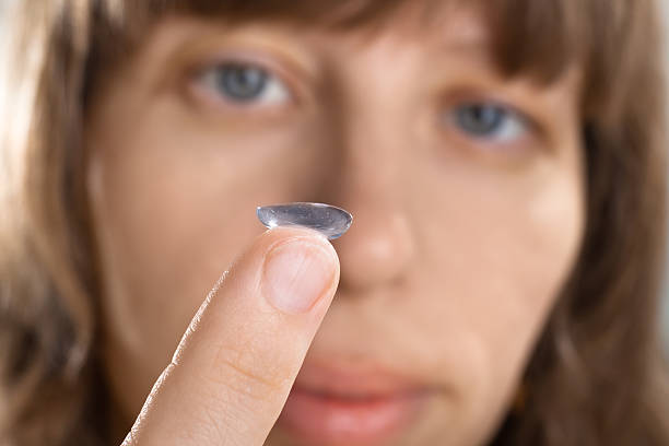 istock woman with contact lens on her finger 537383530