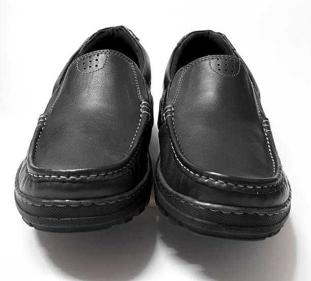 istock Men black cows leather shoes on white background 537383898