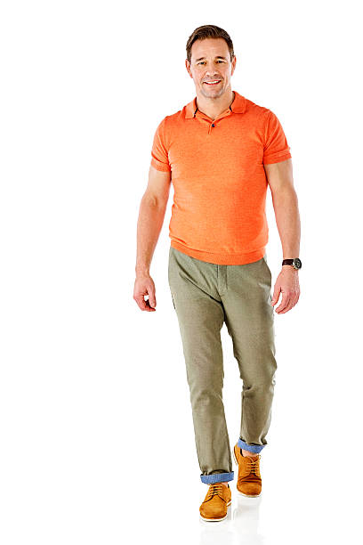 Attractive mature man walking over white background