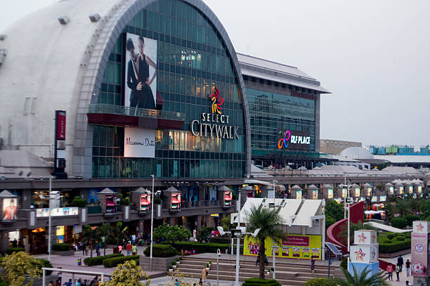 Exterior of Select citywalk in Delhi Delhi, India - 29th May 2016: Outside view of the famous Select Citywalk shopping mall in Saket, Delhi. The huge crowds testify the popularity of these shopping places delhi photos stock pictures, royalty-free photos & images