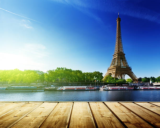 istock background with wooden deck table and  Eiffel tower in Paris 537384765