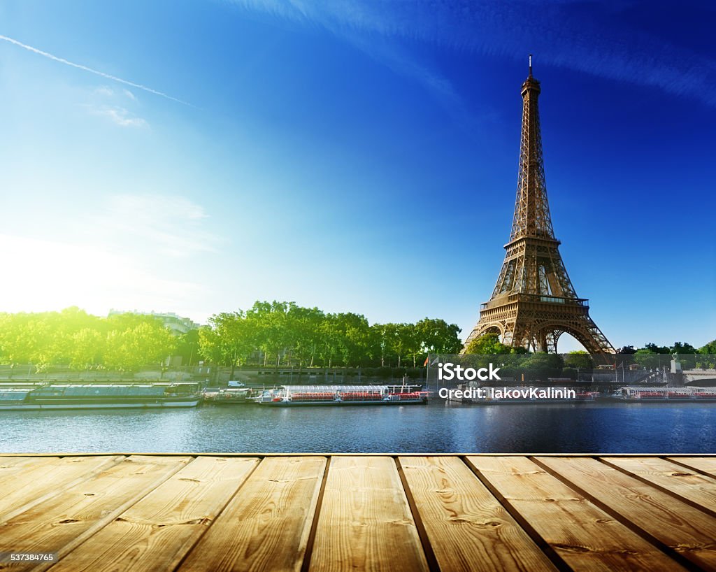 background with wooden deck table and  Eiffel tower in Paris Paris - France Stock Photo