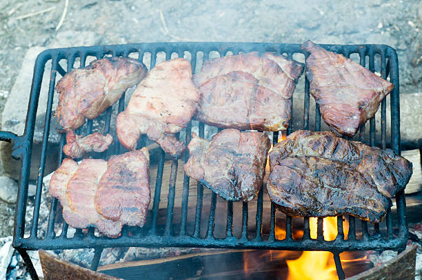 istock Many meat sliced frying on grill 537385538