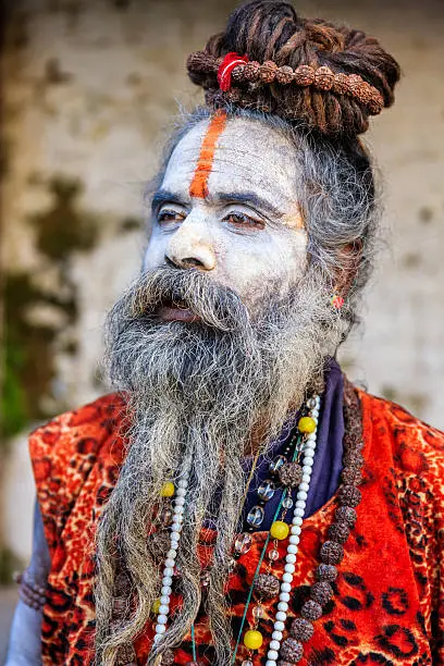 This Sadhu uses ashes of cremated remains to prepare specific white color of his makeup.