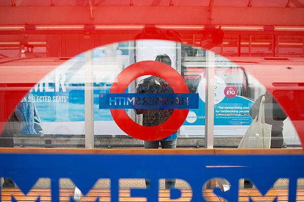 London, UK - May 26, 2016: Hammersmith Station. Man waiting for tube train at station platform.