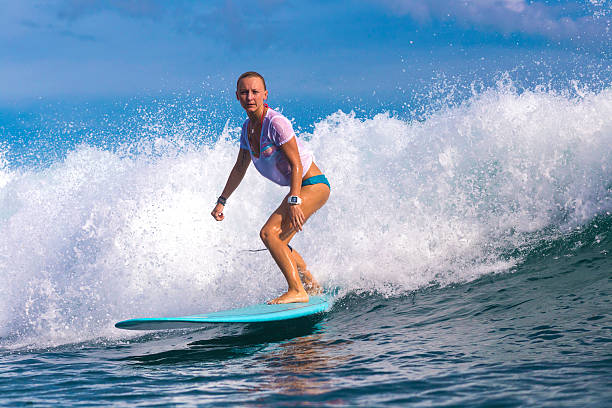 istock Surfer girl on Amazing Blue Wave 537387777
