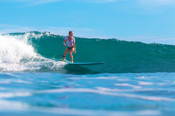 istock Surfer girl on Amazing Blue Wave 537387779