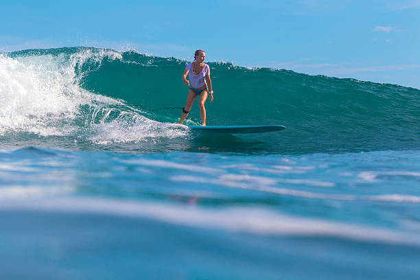 istock Surfer girl on Amazing Blue Wave 537387781