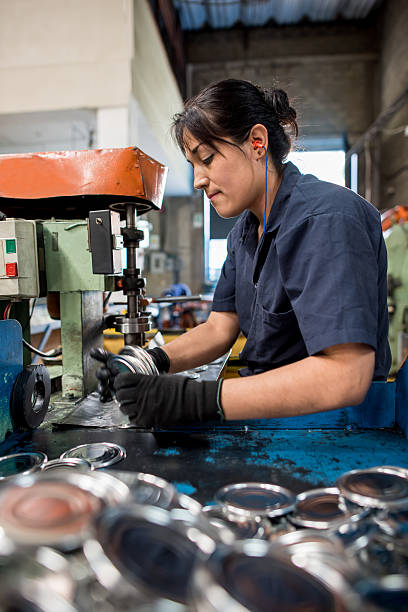 istock Female worker working at a metal factory 537388378