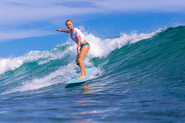 istock Surfer girl on Amazing Blue Wave 537388407