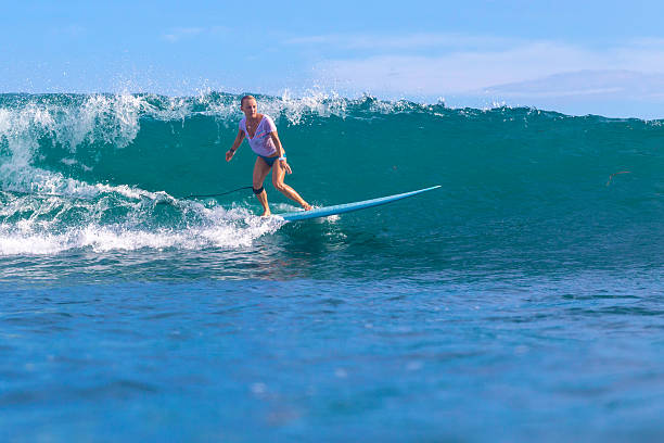 istock Surfer girl on Amazing Blue Wave 537388429