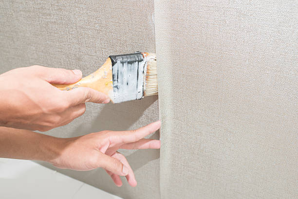 istock handyman painting on the wall 537389214