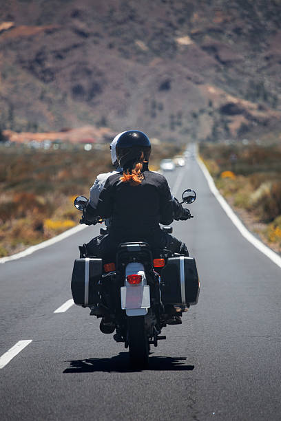 istock couple on a motorcycle traveling 537389894