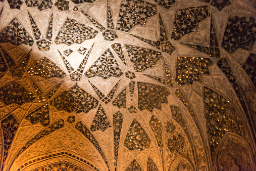 Inside the Musamman Burj (Jasmine Tower, Jasmine palace),Agra fort, Agra,INDIA. Where the place that emperor Shah Jahan who built Taj Mahal was imprisoned by his son and died here. Very nicely carved ceiling that shimmers in the glow of candles. 