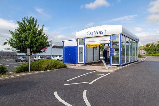Swansea, UK: June 01, 2016: An automated car wash adjoined to a Tesco petrol station. 