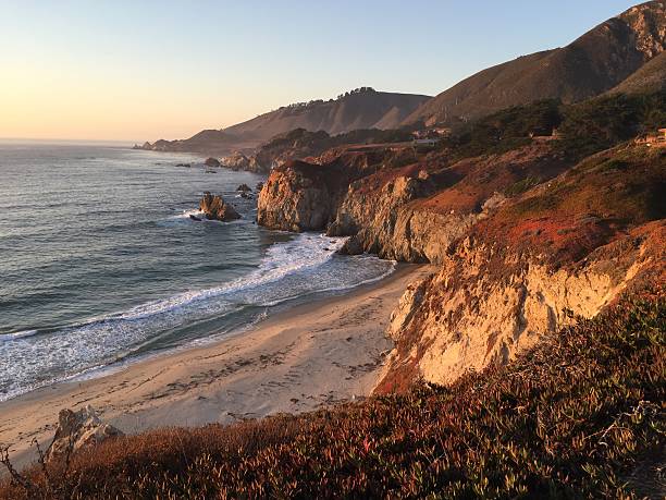 istock Southern California coast at sunset with ocean waves and beach 537390426