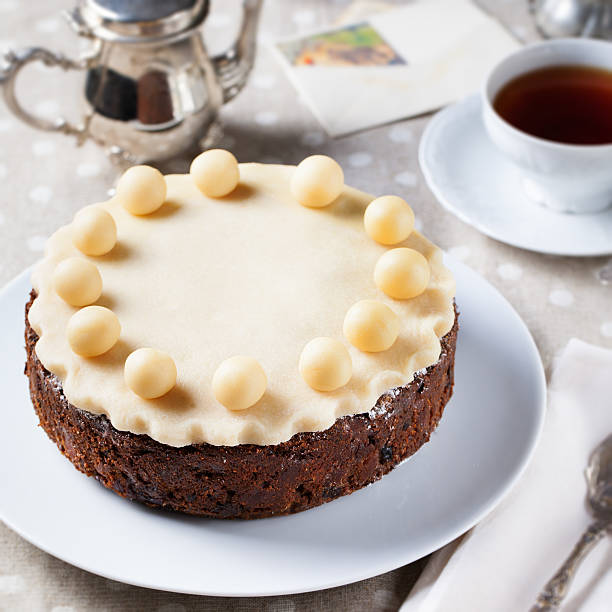 istock Traditional English Easter cake with marzipan decoration on white plate. 537391848