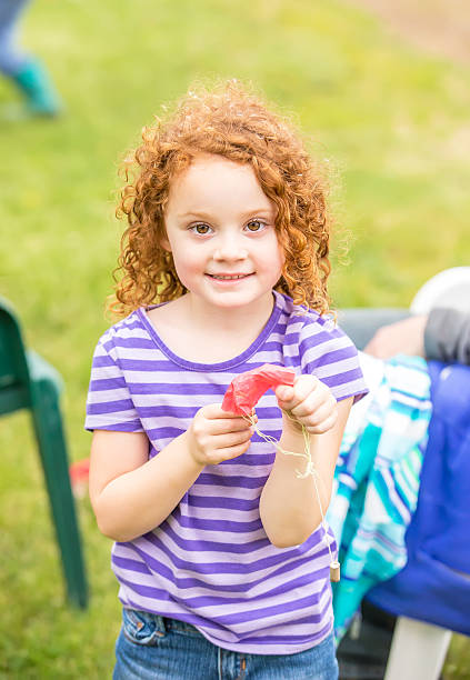 istock Girl Holding Parachute From Fireworks 537392830