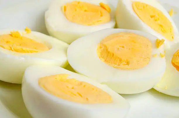 Eggs boiled hard-boiled on a light background.