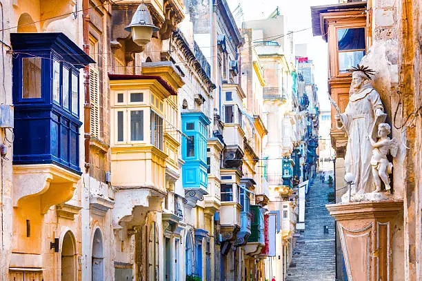 Typical Narrow Streets With Colorful Balconies In Valletta,Malta,Europe.
