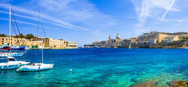 Panoramic View of Valletta With Sailing Boats In Turquoise Sea,Malta.