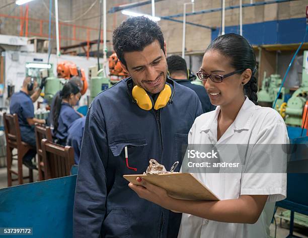 People Working At A Metal Factory Stock Photo - Download Image Now - Activity, Adult, Blue-collar Worker